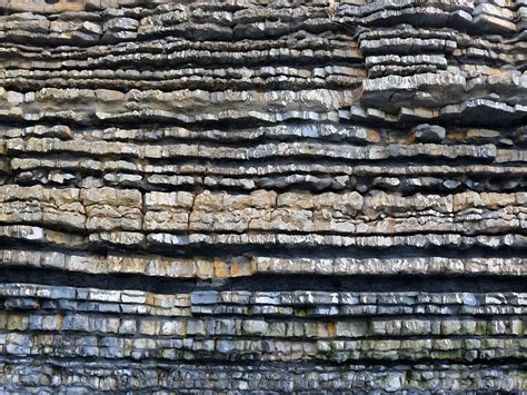 Limestone is a type of rock that is made up of bits of animal shells. Over millions of years these shells collected on the ocean floor. As layers of shells and mud built up, the lower layers slowly hardened into limestone.. 