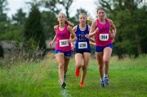 Lincoln East sophomore Mia Murray runs to victory in the A