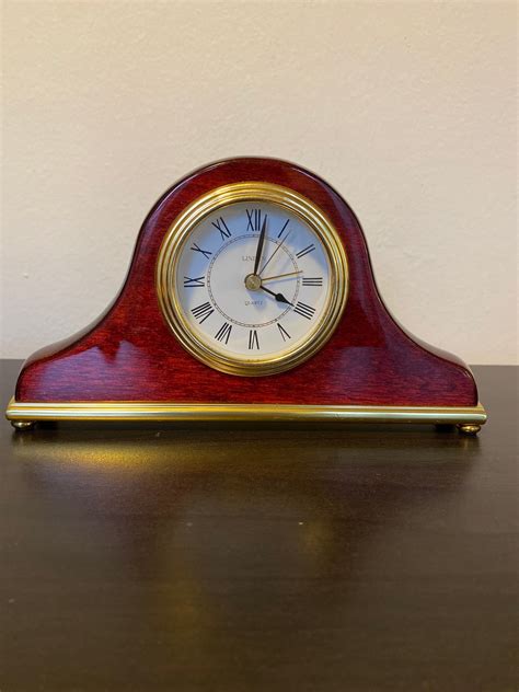 Linden solid polished wood quartz mantel clock, with a