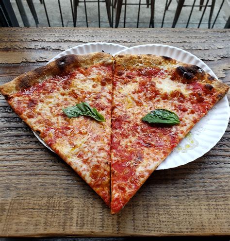 Lindustrie pizza. The 30 Best Pizza Places in NYC At this perpetually packed slice shop, guests order up thin crust, burrata-topped pies and eat off paper plates while sitting on a patio table or nearby bench. 