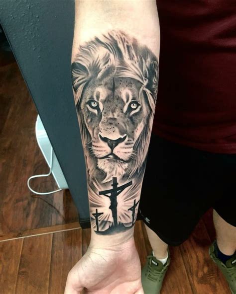 Cross lion tattoo – This tattoo design combines a Christian or biblical symbol, such as a cross, with a lion’s head. also known as a “cross lion” tattoo. The lion is frequently shown as contained within the cross and has arresting eyes (typically colored). The tattoo would look great on the forearm, breast, .... 