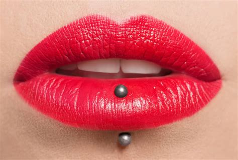 Lip iercing. Smiley piercing: A type of oral piercing that is placed horizontally through the upper lip, passing through the frenulum, which is the small fold of tissue that connects the upper lip to the gums ... 