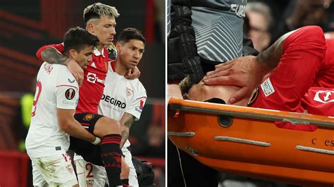 Lisandro Martinez in TEARS as two Sevilla stars carry him off