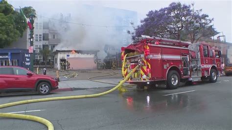Little Italy fire prompts road closures near airport