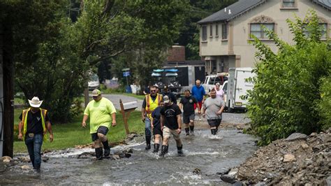 Little relief in sight from onslaught of searing heat and rising floodwaters in parts of US, 2 dead
