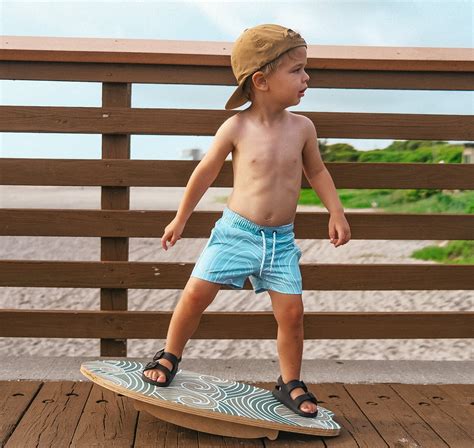 Little surfer dude. Introducing our Bamboo two piece long sleeve sets: Your little one's ultimate ticket to dreamland! Crafted from soft bamboo fabric, this beach and surf-inspired set ensures cozy sleep and relaxed lounging wherever you are. 95% Bamboo 5% Spandex Care instructions: We recommend washing separately from other clothing the 