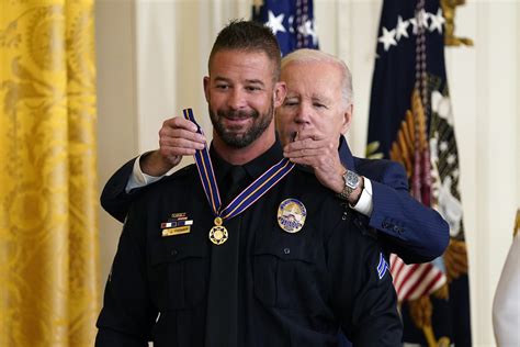 Littleton officer receives Medal of Valor from Biden for heroic action