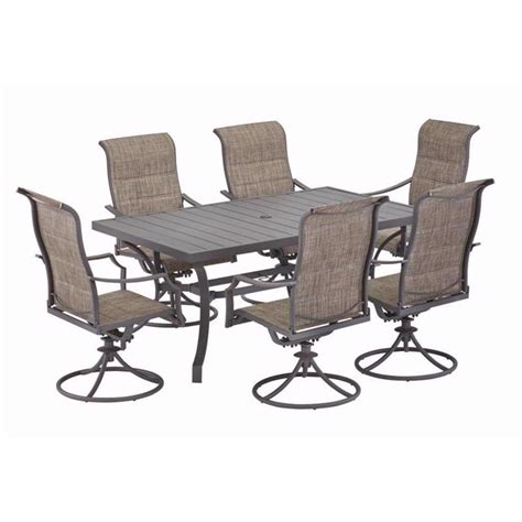 7 pc Steel Dining Set featuring 6 swivel chairs for comfort and style for any outdoor or indoor location. Comfortably seats 6 guests swivel sling chairs. Features weather resistant steel. Durable for long lasting use. Ainsley Umbrella not included.. 