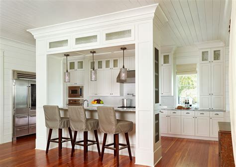 Load bearing wall kitchen island with columns. 1. Kitchen Complement. This kitchen design incorporates the square columns for both aesthetics and function. The ceiling uses the same types of beams as a room divider and to accent the space, as well as provide load-bearing support. The color and texture of all the beams is designed to work with the cabinets. 