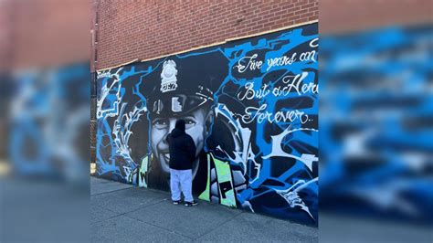 Local artist restores Worcester mural to fallen police officer