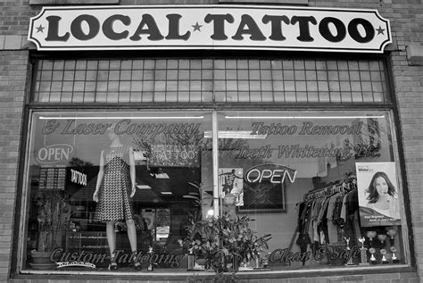 This is about the time we start seeing permanent tattoo shops pop up in New Orleans. (Before that, artists tended to migrate from city to city.) In 1955, George Pinell — nicknamed “The Professor” and “Old Man” because of his status in the local electric tattooing scene — opened up a tiny shop under the Canal Street ferry terminal.. 