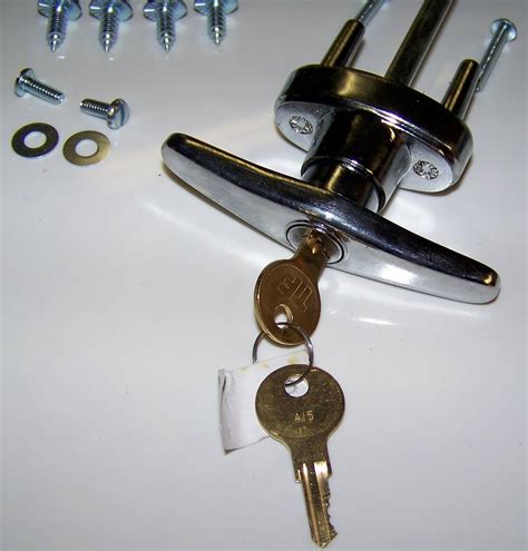 Lock for a garage door. This T-locking handle is constructed from zinc diecast and comes in a chrome plated finish. It features a 5/16 inch x 5-4/8 in. sq. shaft with an overall length of 6-3/8 in. from top of handle to end of shaft. The mounting hole are 1-1/2 in. on center and fasten through the inside of the door. The handle of this item … 
