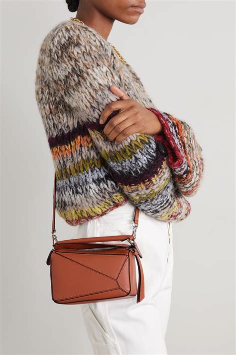 Loewe mini puzzle. Shop Women's Loewe Puzzle Bags. 173 items on sale from $1,305. Widest selection of New Season & Sale only at Lyst.com. Free Shipping & Returns available. SKIP NAVIGATION. ... Puzzle Edge Mini Two-tone Textured-leather Shoulder Bag - Brown. From NET-A-PORTER. $3,015. Loewe. Puzzle Leather Shoulder Bag - Natural. From … 