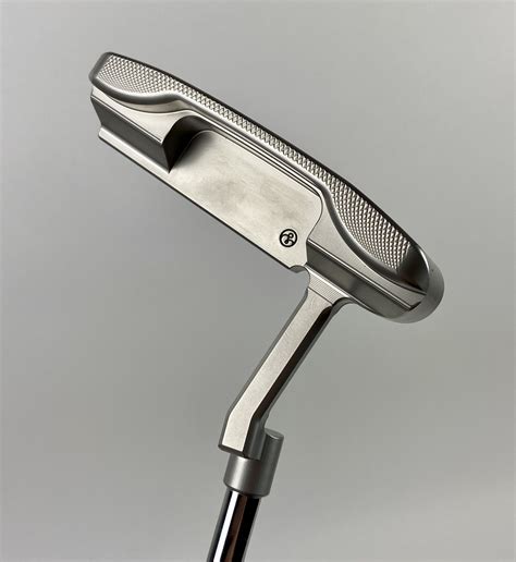 Logan olson putters. Mar 13, 2024 · The custom Logan Olson putter design features a dot on the crown, grooves on the face, and two weights located on the sole. The shaft used is a Mitsubishi Diamana P105-gram 1.0-flex, paired with a ... 