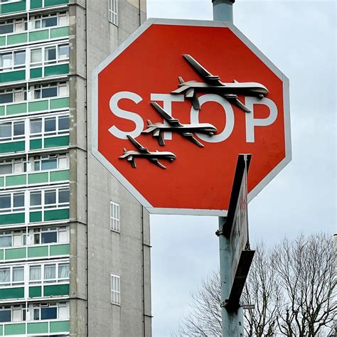 London police investigate the alleged theft of a Banksy stop sign decorated with military drones