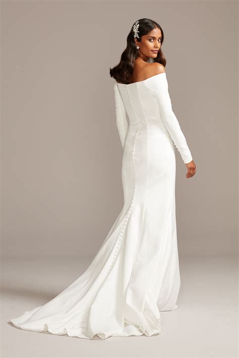 Long sleeve off the shoulder wedding dress. Crepe Off-the-Shoulder Sheath Wedding Dress. STYLE# WG4033. 4.8. (51) $299.95. Buy in monthly payments with Affirm on orders over $50. Learn more. 