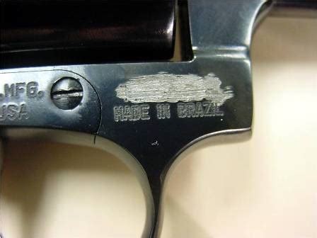 To check the serial number on a gun, first locate