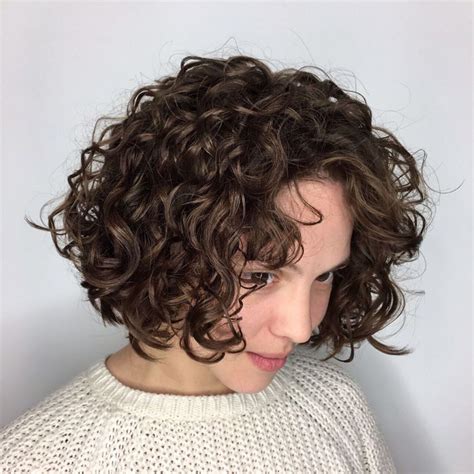 The 3A long bob with bangs consists of big, tight curls that create a huge hairstyle on your natural hair. A lob chop frames the face and suits any face shape. Enough amount of curling cream or gel would help boost the curls' definition, for sure. Instagram @leysahairandmakeup.