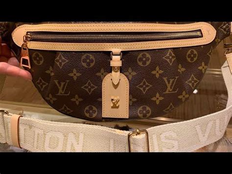Louis vuitton high rise bumbag. This is an authentic LOUIS VUITTON Empreinte BumBag in Black. This stylish belt bag is created of traditional Louis Vuitton monogram-embossed calfskin leather in black. The bag features a leather top handle, an adjustable waist strap, and a rear zipper pocket. The main zipper opens to a orange microfiber interior. 1377737. 