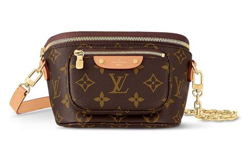 Louis vuitton mini bumbag. This is an authentic LOUIS VUITTON Monogram Mini Bumbag. This stylish belt bag is crafted of Louis Vuitton's traditional monogram on coated canvas. The bag features a removable, adjustable vachetta cowhide leather strap as well as an optional gold chain strap. The bag has two compartments, a main zipper compartment that opens to a brown … 