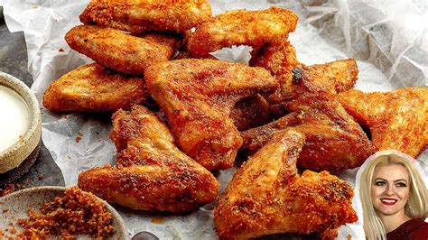Louisiana rub wings. Preheat the air fryer to 400°F. Stir together the rub ingredients. Pat the wings dry with a paper towel, toss them in olive oil, and then sprinkle generously with the dry rub, reserving 1 tablespoon of the rub. Gently massage the rub into the wings. Place the wings in the air fryer basket in a single layer. Cook for 15 minutes. 