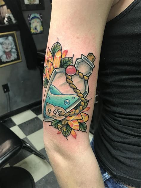 Love potion 9 tattoo done by Danica at Anchor Tattoo Parlor in