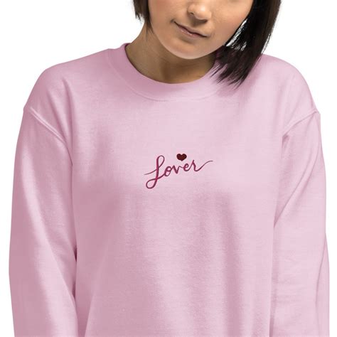 Lover sweatshirt taylor swift. In 2012, Taylor Swift wrote “The Lucky One”, a song about the dangers of fame. Lyrics like, “Another name goes up in lights. You wonder if you’ll make it out alive. And they’ll tel... 