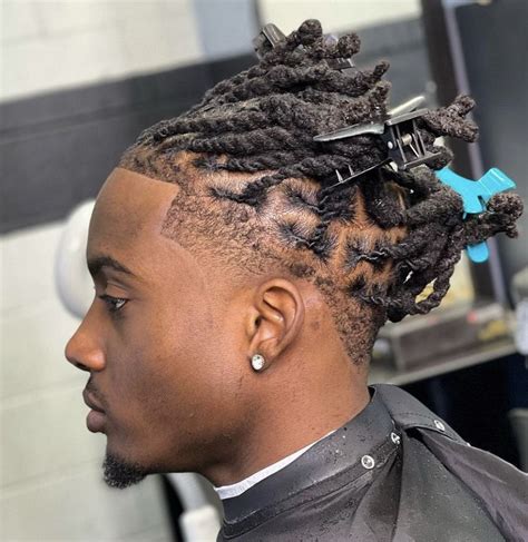 Low taper dreads. Go for a mix of thin and thick braids in the top half of your hair, using a high fade to edge up the bottom half. 17. Zig Zag Braid Fade. Black men with long hair definitely have more length to play with when it comes to braided hairstyles. 
