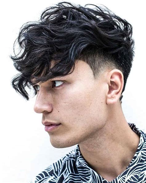 Low taper fade with long wavy hair. Hey guys! Its been a while since I posted a full haircut video, a lot has changed and now I'm ready to share what I've been working on this past year. Here i... 