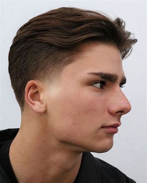 The low taper fade is a variation of the classic taper fade, known for its gradual transition from longer hair on top to shorter hair on the sides and back. What sets the low taper fade apart is its placement, starting lower on the head, just above the ears. This creates a more defined and noticeable fade, while still maintaining a subtle and ...