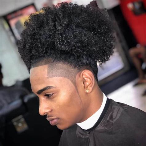 The low temp fade can be a bold and clean-cut look that will complement the longer hair on top for a sleek vibe. With a thick brush back, the trendy tapered design creates a seamless transition that elevates the look. ... A curly hair fade can look awesome with a modern shaved hairline design that blends into the neck. With a low .... 