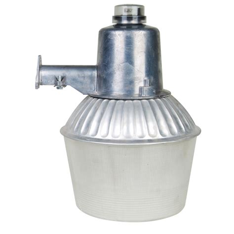 Silver-finished die-cast aluminum fixture is corrosion-resistant and durable. 70 watt medium base high-pressure sodium Bulb provides 24,000 hours of light. Color temperature 2000K at 5,500 lumens provides bright light. Photocell feature turns on at dusk and off at dawn for convenience and energy savings. Sturdy mounting arm installs to wall ...
