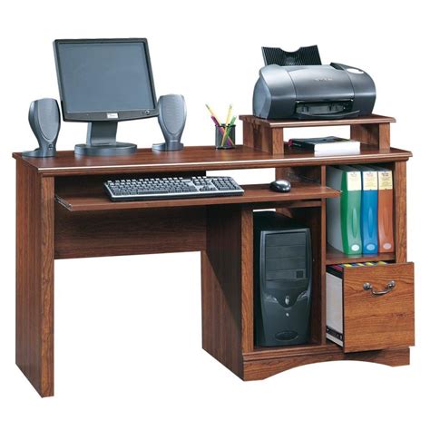 Lowes computer table. Size: 54w 25d 30.25h. Hardwood solids and engineered wood construction. Left side features a CPU compartment (CPU compartment is vented for ventilation) with shelf and utility drawer. Center features a drawer with a drop down front that can function as a drawer or keyboard tray. 1-year limited warranty. 