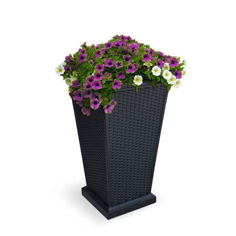 Lowes tall black planter. Distinctive and sleek, this planter is the perfect piece to refresh a front entrance. Characterized by a subtle textured finish and contemporary square tapered design, it is ideal as a patio accent or as part of a group of planters. Molded from high density plastic through a patented process known as V-Resin technology molding. Flexible, impact ... 