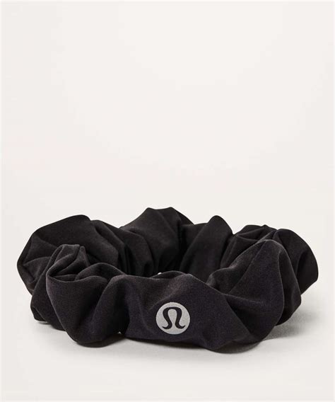 With Lululemon's Light Locks Scrunchie, you can increase your visibility at night while holding your hair back securely. Crafted specifically with outdoor runners in mind, this scrunchie features reflective trim that lights up the night and adds a tastefully subtle design touch during the day. The Light Locks Scrunchie is smaller and tighter ...