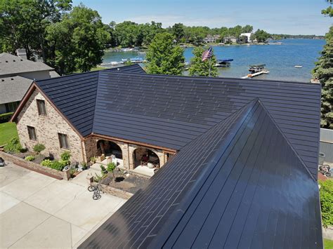 Luma solar shingles. Solar array and shingle roof = $42,000. Solar array and metal roof = $70,000. Solar array and tile roof = $111,000. Solar array and slate roof = $134,000. Clearly, the Tesla Solar Roof can provide significant cost savings over combining standard solar panels with other high-quality, aesthetically pleasing roof types. 