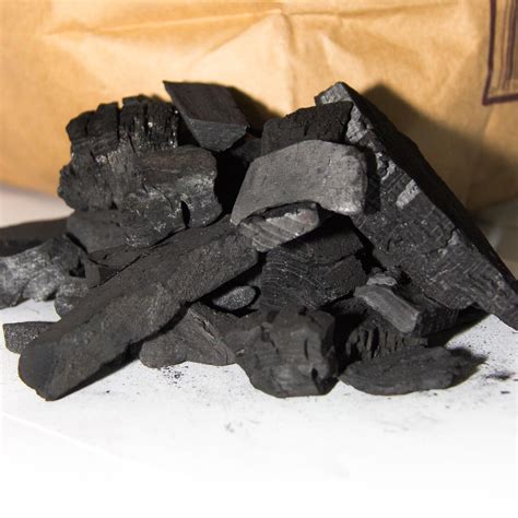 Lump charcoal. This Jealous Devil is a 100% natural hardwood lump charcoal free of chemicals, fillers, and scrap wood.. We were eager to try it after reading many positive reviews, so we ordered a bag. It was filled with large- to medium-sized pieces of lump charcoal and contained little to no charcoal dust. 