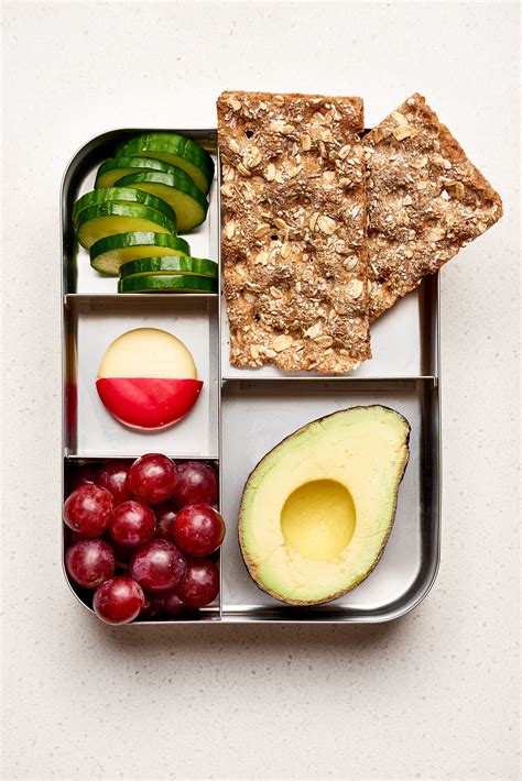 Lunch to go. But oftentimes, your work schedule keeps you away from the kitchen. Instead of settling for fast food (or going hungry), you can create a quick, easy, on-the-go option. These LIVESTRONG.COM creations can be made quickly each morning — without sacrificing your lunchtime nutrition needs. Image Credit: Adobe Stock/StockPhotoPro. Video of the Day. 