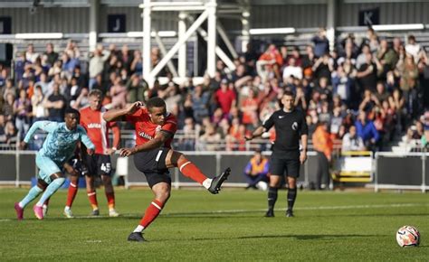Luton earns its first Premier League point in 1-1 draw with 10-man Wolves