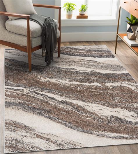 Luxe Weavers Euston Modern Abstract Area Rug is soft and stain resistant. Modern, non-shedding rugs that are safe for kids and pets. The artistic design harmonizes with both trendy and traditional home décor. Machine woven rugs with a medium pile height of 0.5 inches and dirt resistant properties. Define bedrooms and dining rooms with the ...