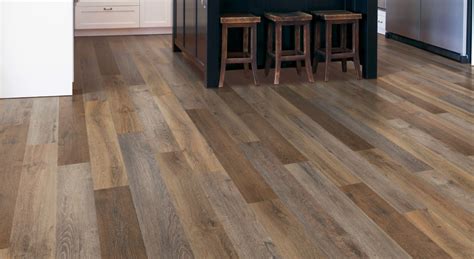 Luxury vinyl plank flooring cost. Vinyl planks are more water-resistant than laminate and are therefore a better choice for a kitchen or basement floor. Though it looks similar to laminate, vinyl is built differently to be water-resistant, and even waterproof, with WPC/SPC cores. Laminate, however, is less expensive than luxury vinyl. 