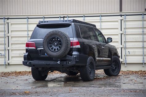 98 LC rear locker. 275 70 R18 Nitto Exo Grapplers on TRD Tundra wheels, OME 865 with 1in coil spacer. Ironman Foam Cell Pros up front and Adjustable Tough Dog Shocks for the rear. 2013 LX570 Ironman Front bumper, ARB Base Rack.. 