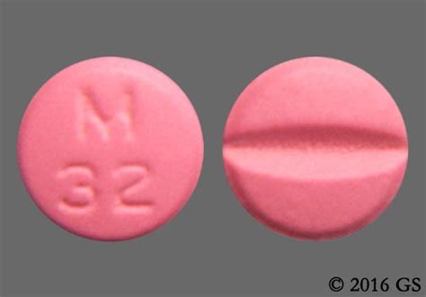 M C 25 Pill - pink round. Pill with impri