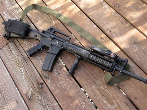 The M16A4 is the fourth generation of the M16 series and is a 3-round burst rifle. It is equipped with a removable carrying handle and a full length quad Picatinny rail for mounting optics and other ancillary devices. The FN M16A4, using safe/semi/burst selective fire, became standard issue for the U.S. Marine Corps.. 