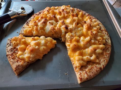 Mac and cheese pizza. First, prepare the mac & cheese. Prepare noodles according to package directions, but use a bit more milk to make the sauce runnier. Preheat oven to 500F. Spread a small bit of the olive oil on a pizza pan, and place the pizza dough on top. In a small bowl, mix together the rest of the olive oil with parsley, garlic … 