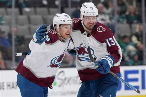 MacKinnon scores 2, leads Avalanche past Sharks 4-3 in OT