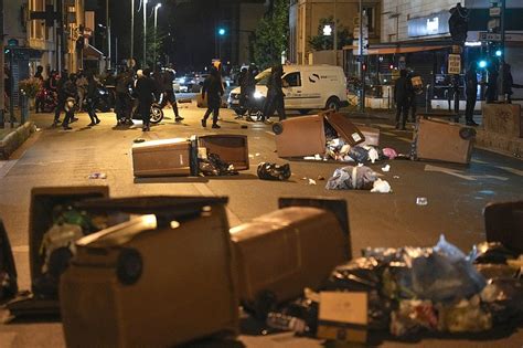 Macron scraps trip amid rioting across France, as loved ones bury teen slain by police