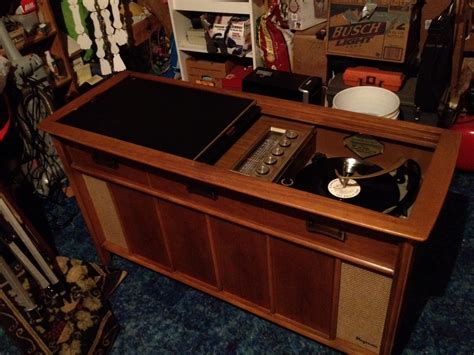 Vintage Magnavox Astro-Sonic console table / record player. Likely from the 1950s or 1960s. It does work, but could use some touch ups from someone familar with vintage electronics.