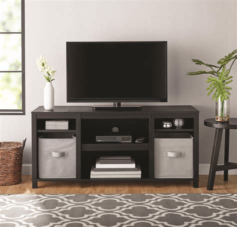 Mainstays parsons tv stand. Jun 14, 2018 · The Mainstays Parsons TV Stand is just the right size for your flat paneled TV up to 50 wide. This TV Stand has tons of open storage so you can keep your cable box and gaming system in the center 2 shelves and still have room to organize your books, remotes and DVDs on the other 4 shelves. 