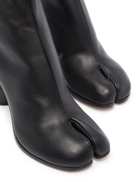 Maison margiela tabi boots. Tabi loafers. $ 1,050. Black. Size Guide. Add to Bag. Pick-up in Boutique. More. The Tabi loafers in calf leather and a contrast brushed leather heel with a back that can be worn up or down. They feature the Tabi split-toe, inspired by the traditional 15th century Japanese sock bearing the same name – launched for the Maison's debut ... 